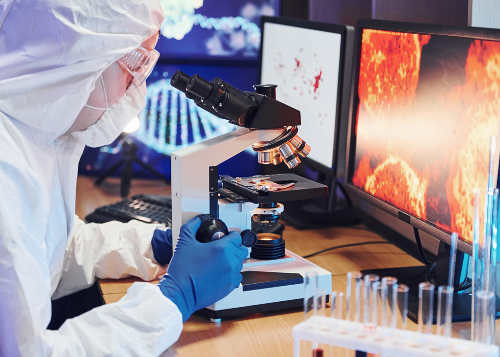 Scientist In White Protective Uniform Near Display 2025 03 18 20 12 41 Utc