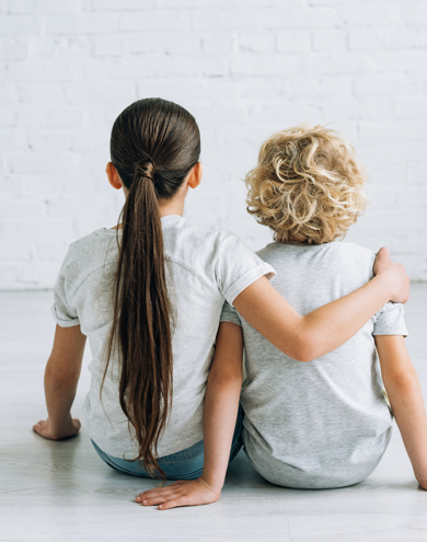Back View Of Two Kids Embracing On Floor At Home 2024 11 19 08 04 30 Utc